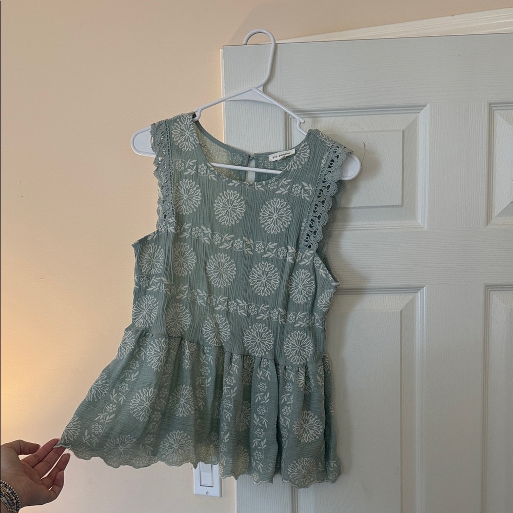 Green Sleeveless Top with Floral Pattern